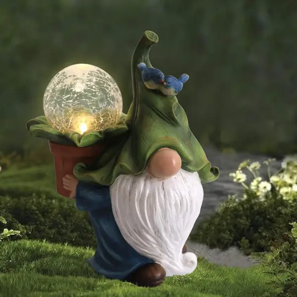 This adorable gnome statue carrying a plant with a magic ball on the back brings lively vibes to your outdoor spaces.